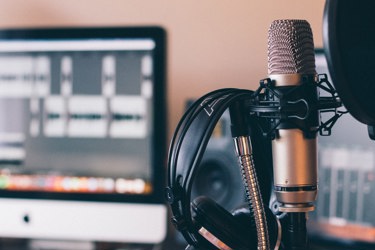 Image of a microphone and computer screen