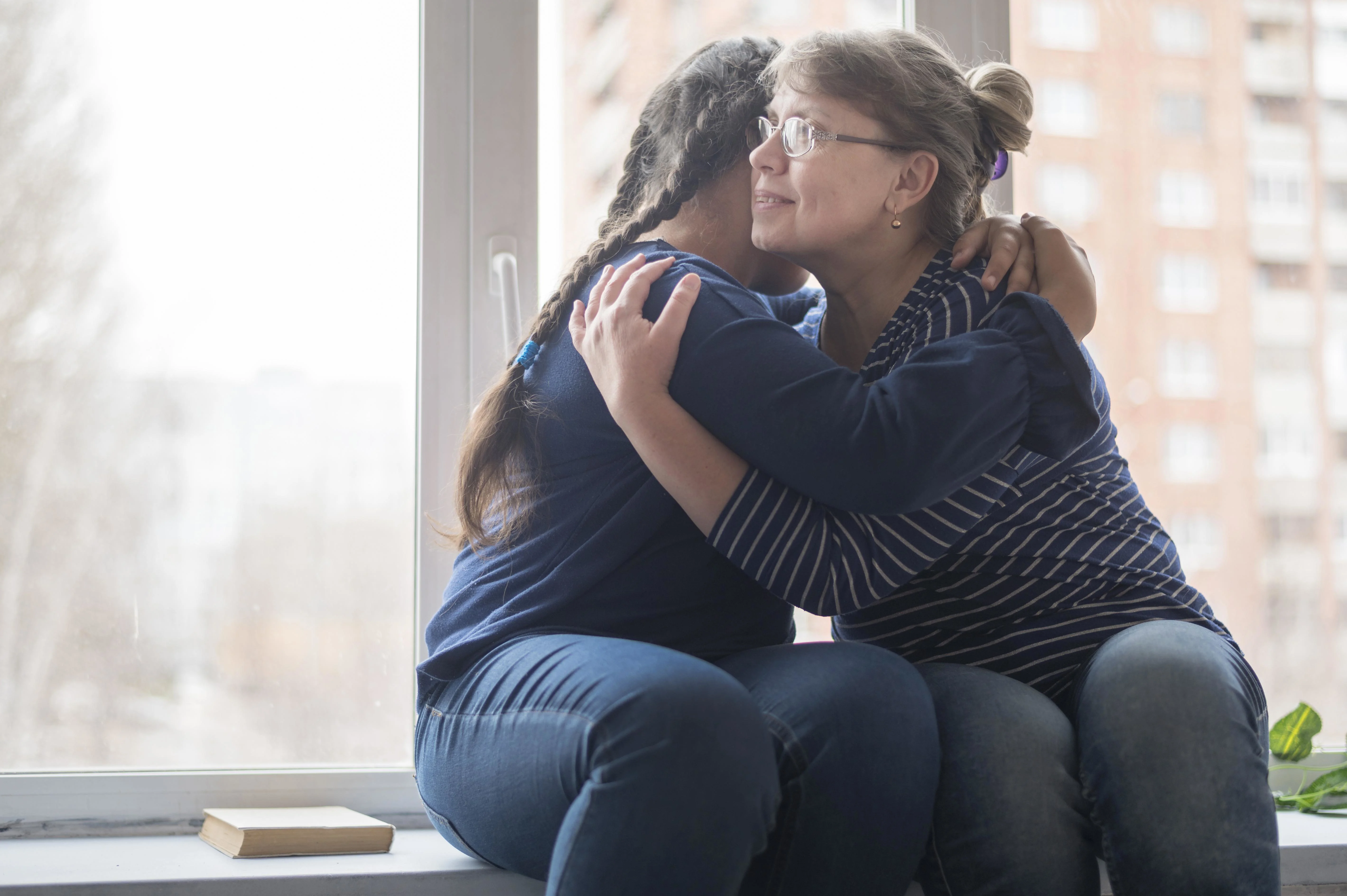 Mom and daughter hugging
