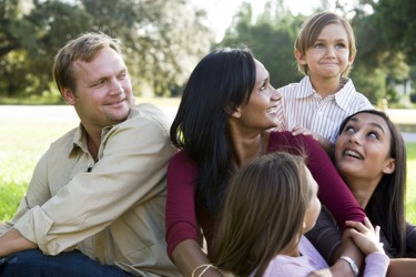 Family looking at younger child 