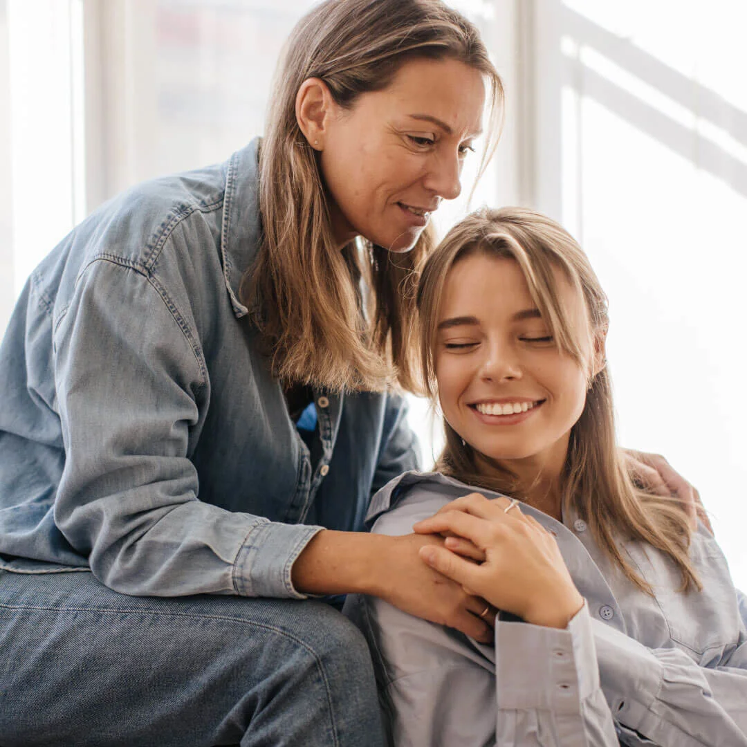 Mother and daughter embracing