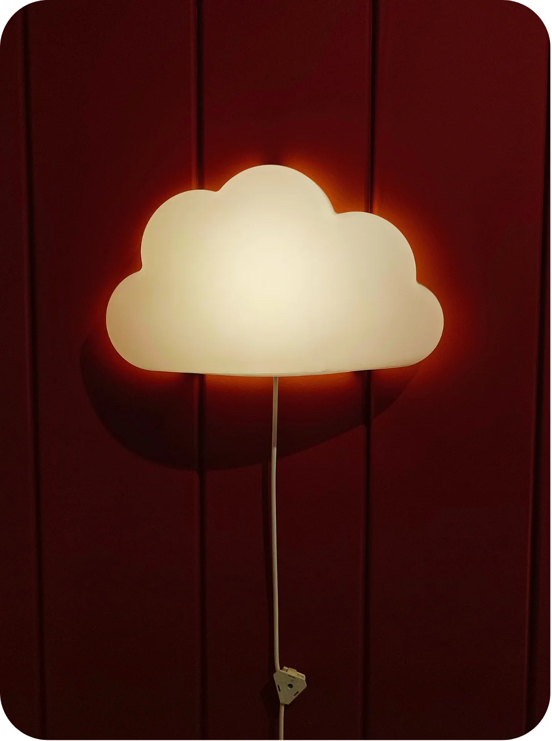 cloud-shaped nightlight on a wall