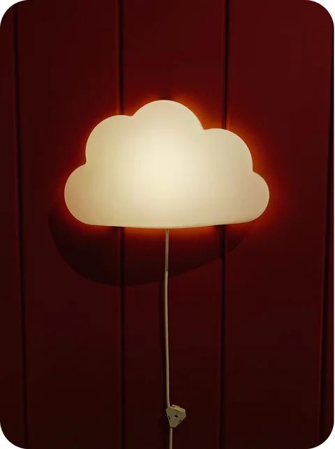 cloud-shaped nightlight on a wall