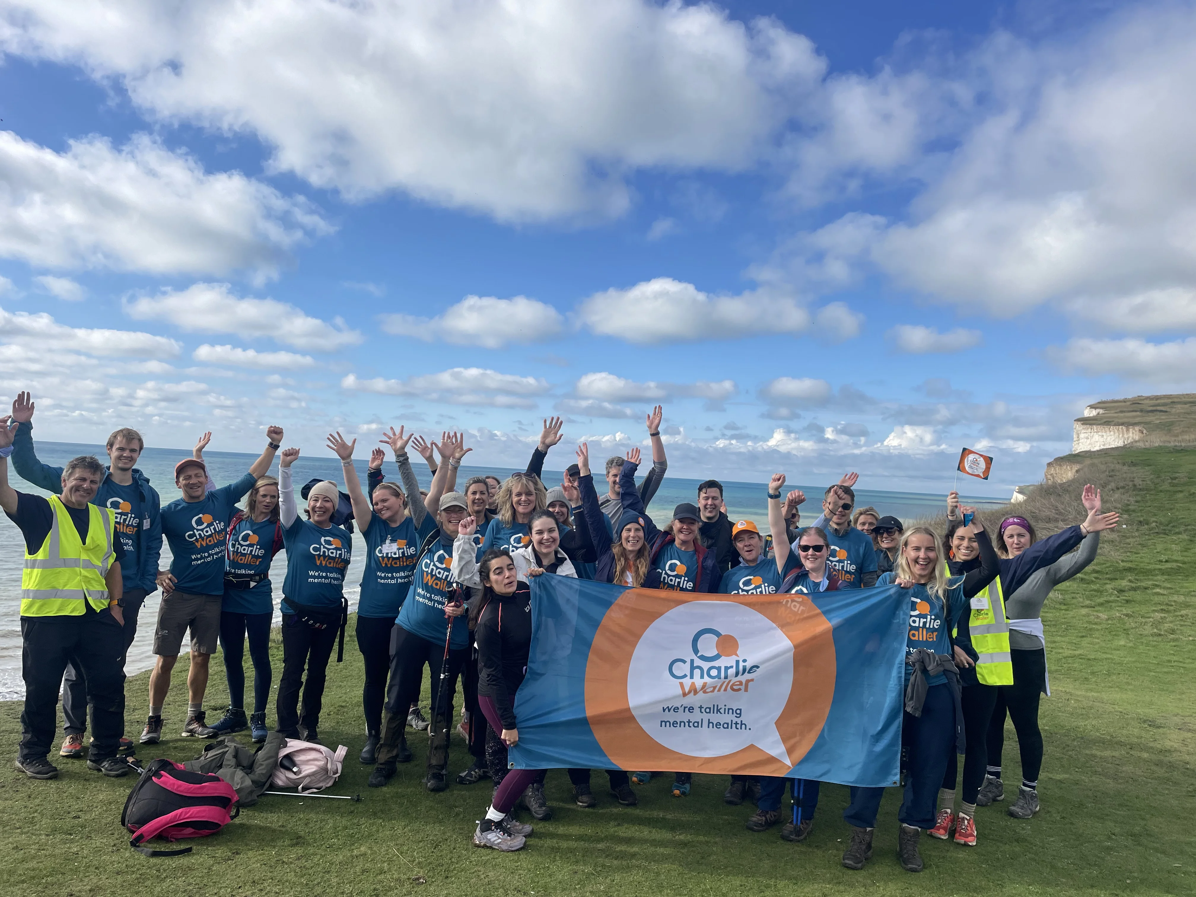 Walk for wellbeing group picture with flag