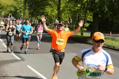 Marathon runners man with arms in air Marathon runners man with arms in air