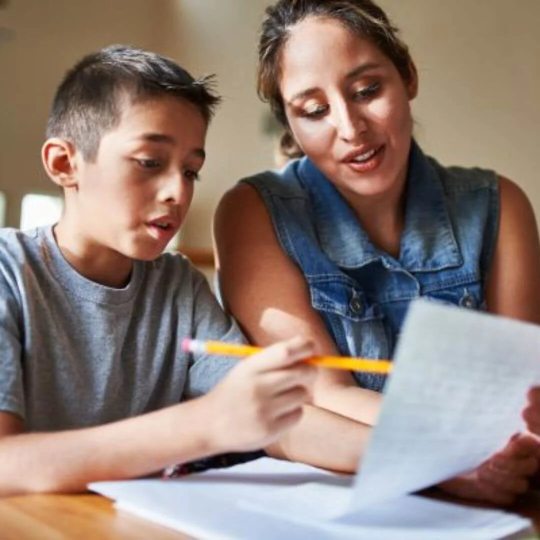 Parent helping child with homework