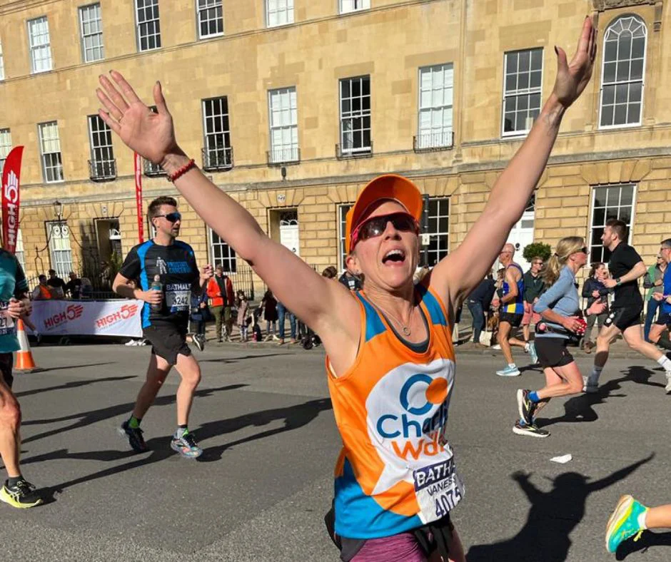 Cambridge Half runner with hands in the air Cambridge Half runner with hands in the air