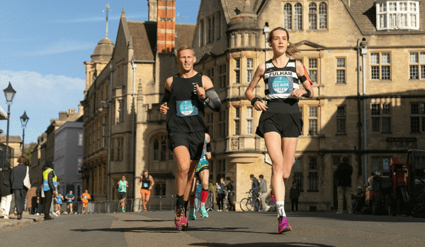 Woman and man running the oxford marathon 