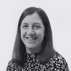 Amy, a woman with medium length hair smiling at the camera 