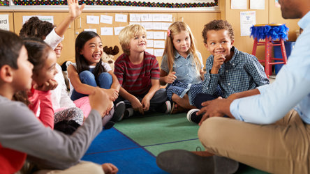 Children smiling at teacher