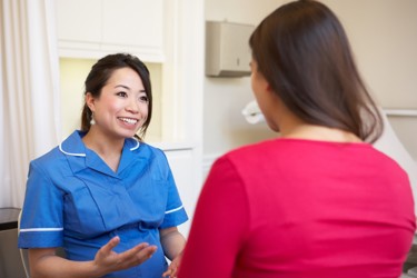 Nurse talking to patient 
