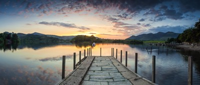 Pier on a lake with sunset 