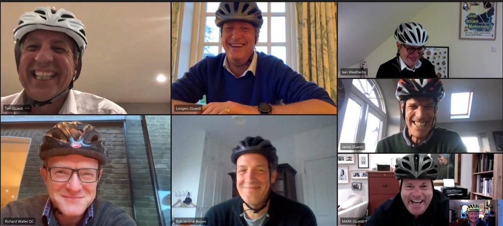 Zoom screenshot of 8 men wearing cycle helmets