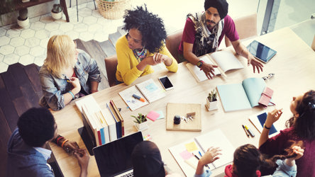 Image of people sitting in an office meeting