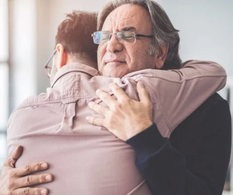Two men hugging Two men hugging