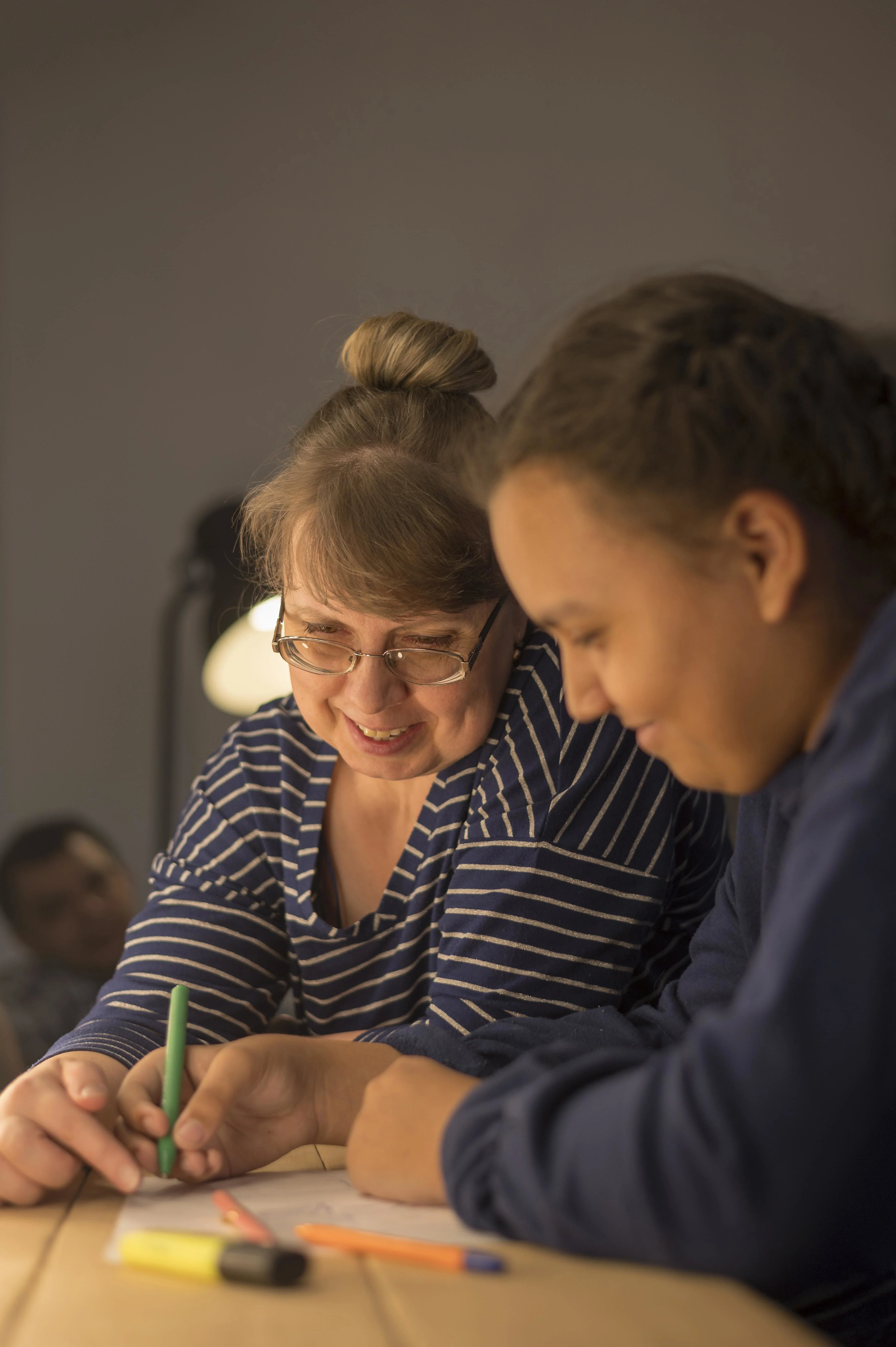 Mom Teaching Daughter Write