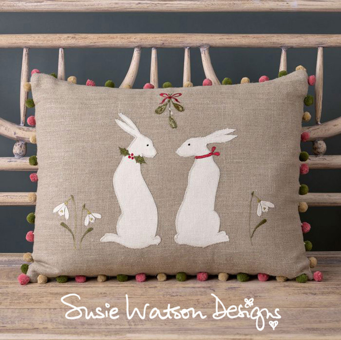 Cushion with rabbits on it