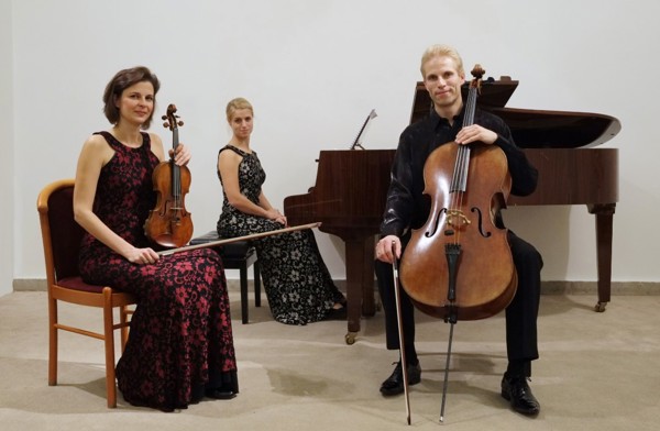 Kinsky Trio sitting with instruments 