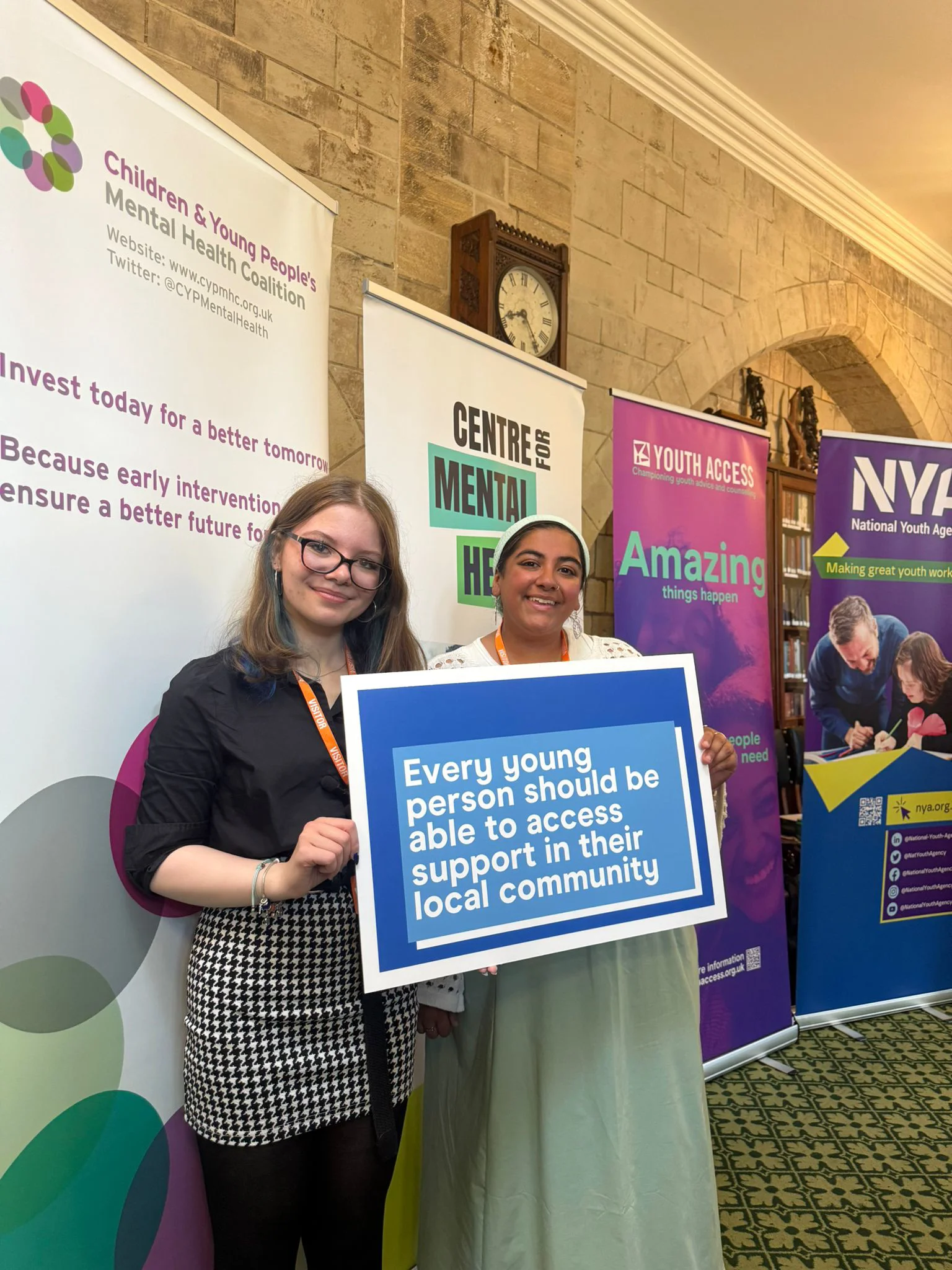 Holly And Fatima Holding Sign