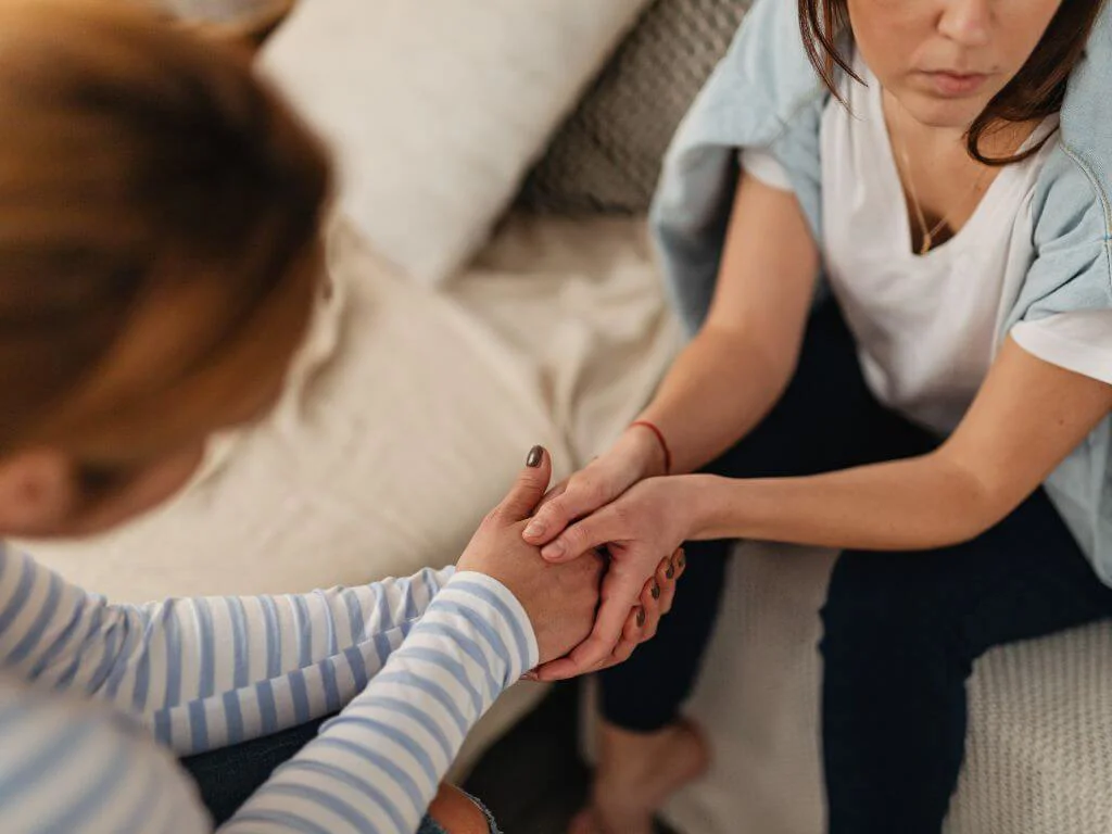 Mother And Daughter Holding Hands