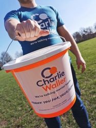 CWT Donation bucket being held by a man in a CWT tshirt